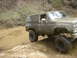 1989 GMC Jimmy - This SUV is navigating a challenging muddy off-road course.