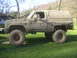 1989 GMC Jimmy - This heavily modified SUV is covered in mud, suggesting off-road use.
