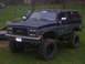 1989 GMC Jimmy - This 1989 GMC Jimmy features a lifted suspension and large off-road tires, giving it a stance.
