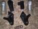 1990 Ford Bronco - A collection of assorted vehicle suspension components are displayed on a textured background.