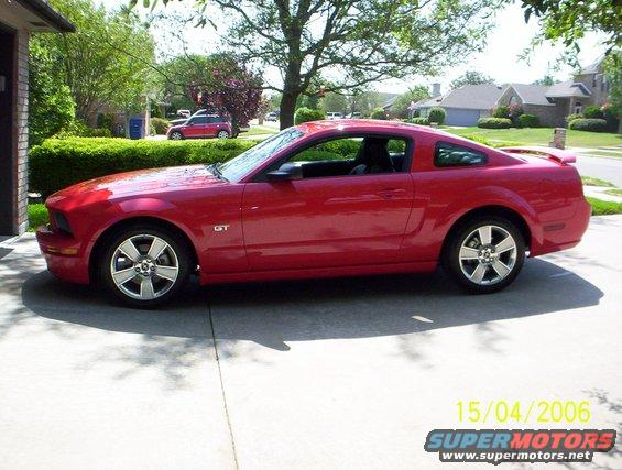 Red 2006 Ford Mustang GT parked in a driveway