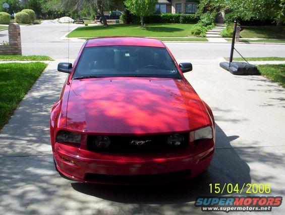 Red Ford Mustang parked in a driveway. Date stamp says 15/04/2006