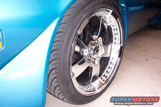Close-up of a chrome wheel and blue fender on a 1979 Pontiac Trans Am