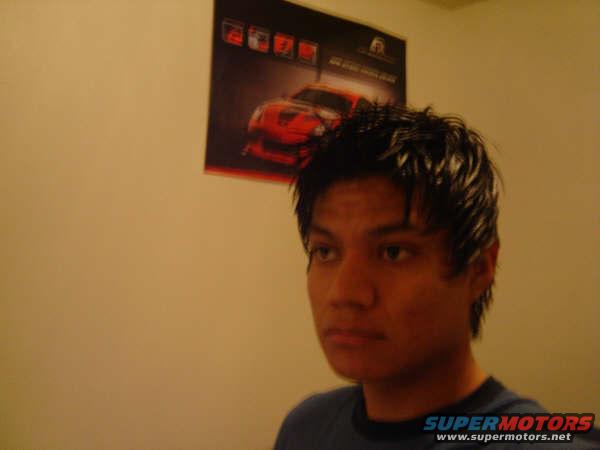 Poster of a red sports car on a wall