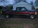 1979 Ford Bronco - This pickup truck, likely a 1995 model, is shown from the side with a two-tone paint scheme and a toolbox mounted in the bed.