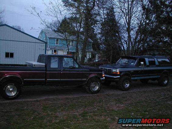 Two pickup trucks parked side-by-side outdoors