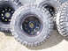 1996 Ford Bronco - Close-up of four Goodyear Wrangler MT/R off-road tires on black wheels.