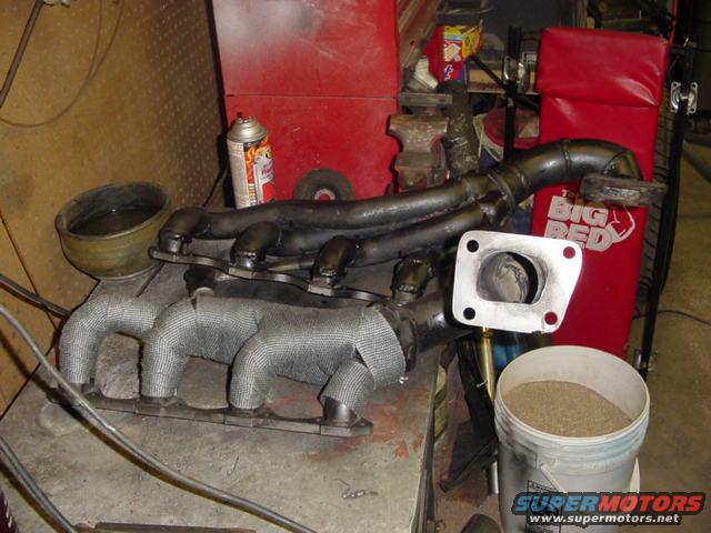 Exhaust manifold with turbo piping and heat wrap