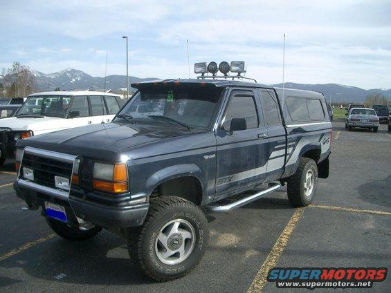 1992 Ford Ranger STX pickup truck, dark blue, 3/4 front view