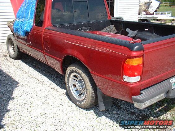 Red 1999 Ford Ranger pickup truck, side view, hood up