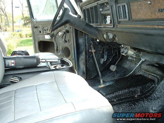 Interior of a 1978 Ford Bronco showing dashboard, steering wheel, and seats