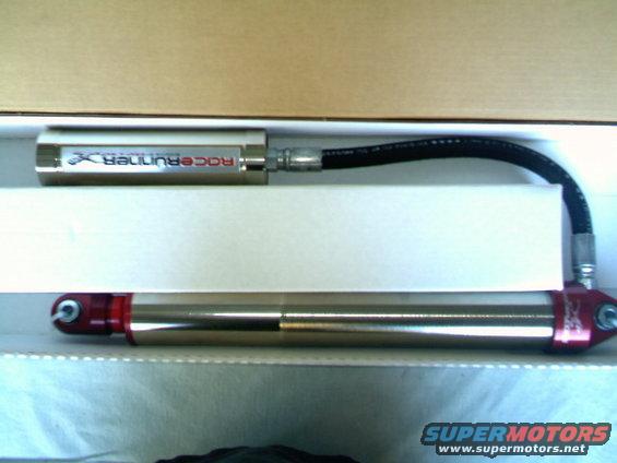 Shock absorber with 'RaceRunner X' label and red end caps, in box