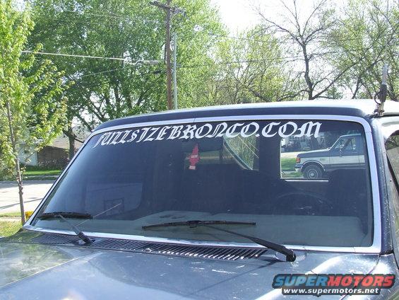 Windshield banner reads FULLSIZEBRONCO.COM; reflection shows a 1987 Ford F-150