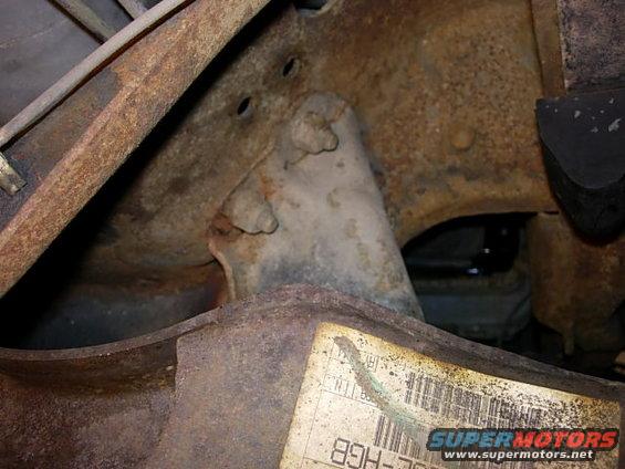 1993 Ford Bronco cracked TTB bracket, close-up of rusted metal