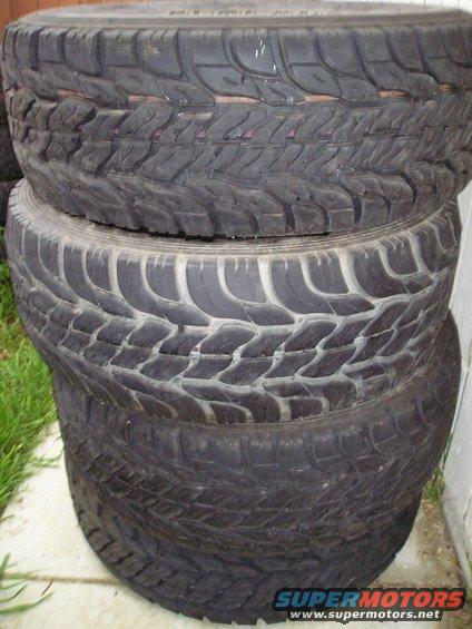 stack of four off-road tires