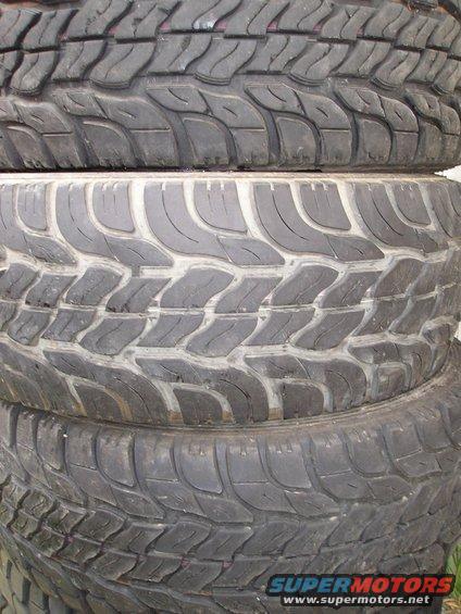 stack of four off-road tires