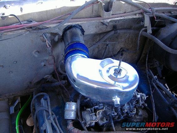 Chrome air intake assembly in engine bay