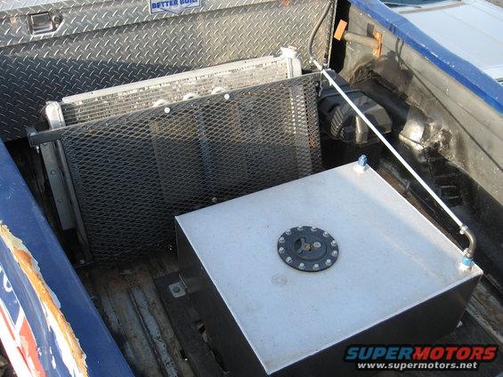 Truck bed with a large custom fuel tank and a radiator installed