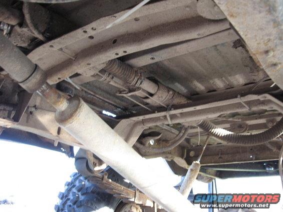 Underside of a 1977 Ford F-150 showing exhaust and suspension