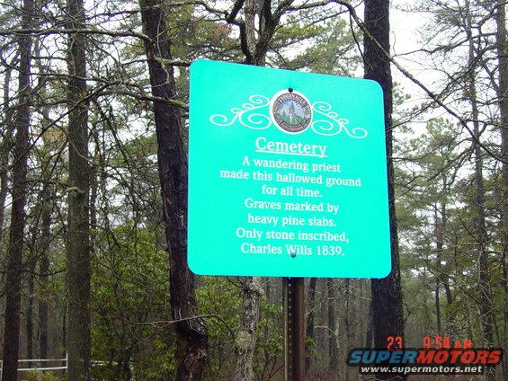 Sign for a cemetery in woods, mentions Charles Wills 1839