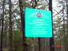 1995 Dodge 1500 - A sign in the woods indicates a cemetery with graves marked by pine slabs and one inscribed stone from 1839.