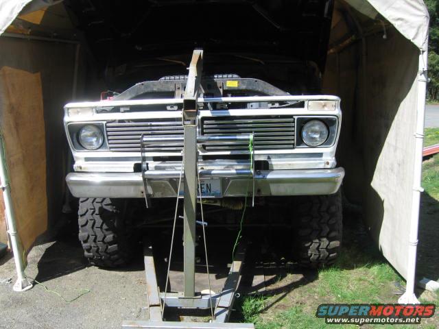 after undoing old motor mounts, raise engine to clear the way.