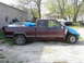 1997 Chevrolet C/K Pickup - This 1997 Chevrolet C/K Pickup is for sale, with the price and contact information written on the side window.