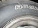 1979 Ford Bronco - Close-up of a tire and wheel assembly, showing tire size and brand markings.