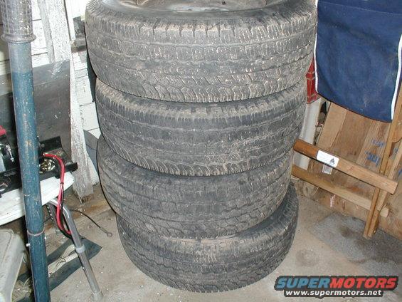 Stack of four used tires
