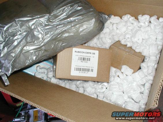 Box with Rubicon Express coil spring spacer and packing peanuts