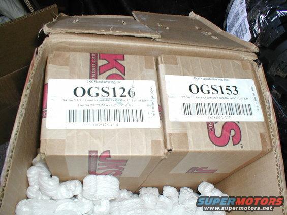 Two cardboard boxes labeled OGS126 and OGS153 from JKS Manufacturing, Inc. with packing peanuts