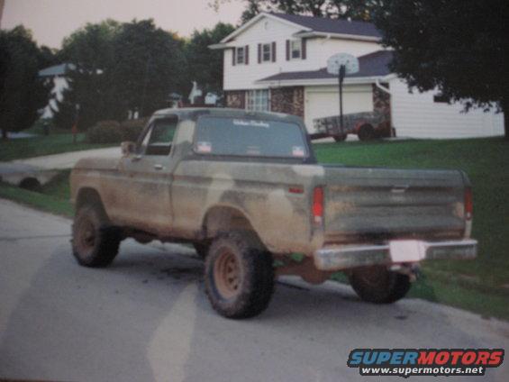 Rear view of a 1977 Ford F-150 pickup truck with camouflage paint