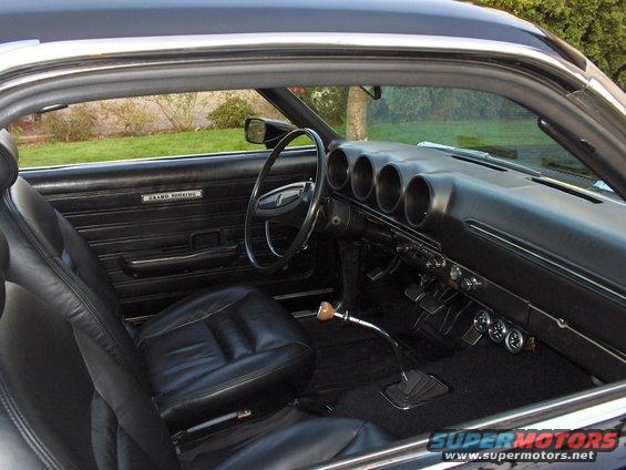 1968 Ford Ranchero interior with black leather seats and dashboard gauges