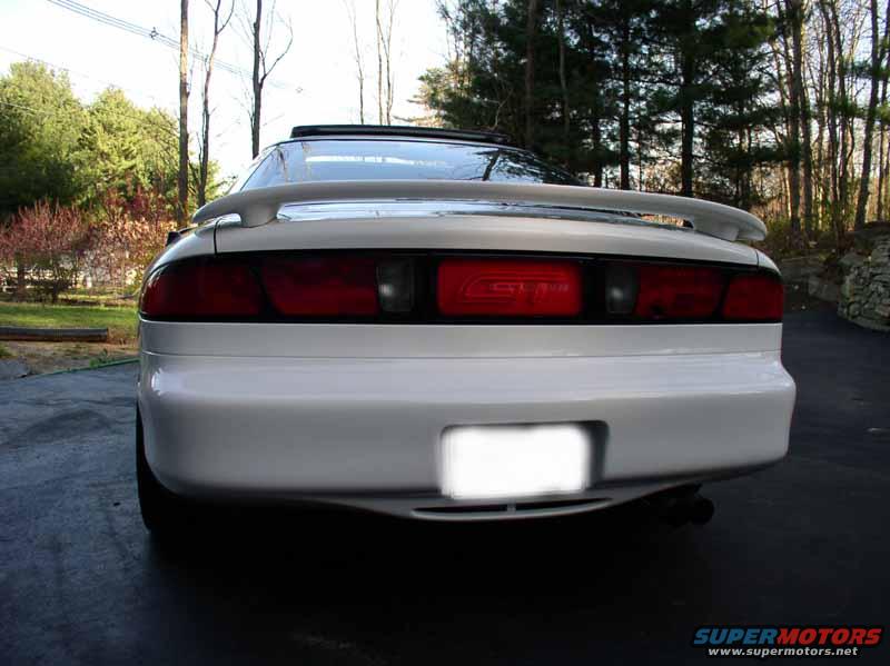 Rear view of a white 1996 Ford Probe GT with a spoiler and tinted windows