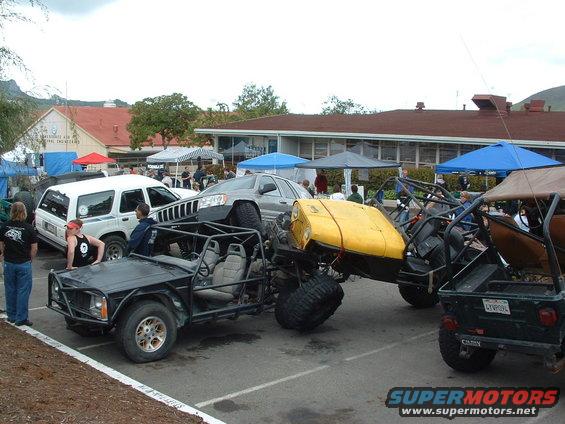 Custom off-road buggy with yellow hood, front view