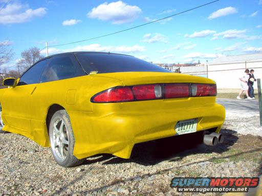 Yellow 1994 Ford Probe rear view with custom exhaust
