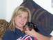 1991 Ford Bronco - Woman with a puppy, wearing a t-shirt with text.