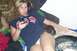 1991 Ford Bronco - A woman with a flip phone and a small dachshund puppy relax on a couch.