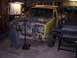 1987 Ford Bronco II - Vehicle undergoing repairs in a garage setting, with parts removed and organized.