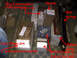 1996 Ford Bronco - Various auto parts are laid out on the floor, labeled with red text indicating their function.