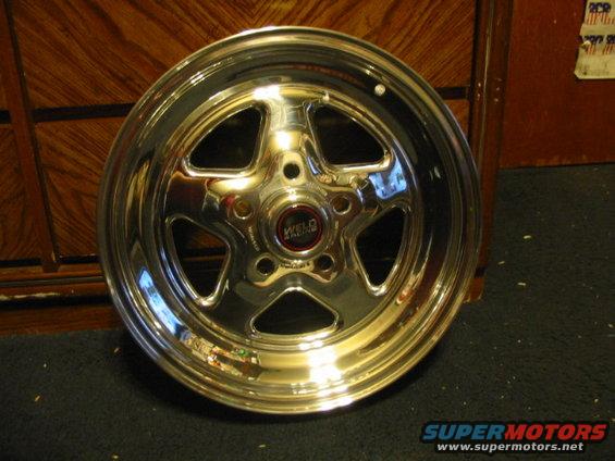 Chrome Weld Racing wheel with five spokes and a red center cap