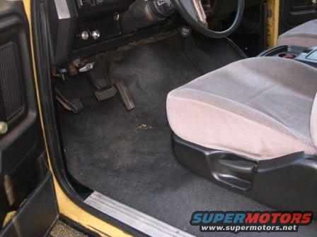 1982 Ford Bronco interior showing driver's side floor, pedals, and seat