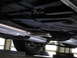 1978 Dodge Monaco - The undercarriage of a vehicle, a dual exhaust system and a tire visible.