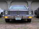 1978 Dodge Monaco - This full-size sedan features a prominent chrome grille and dual headlights, parked in front of a garage.