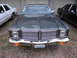1978 Dodge Monaco - Front view of a gray sedan with a prominent chrome grille and dual square headlights, parked outdoors.