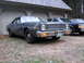 1978 Dodge Monaco - This 1978 Dodge Monaco sedan is parked in front of a garage with two other vehicles visible.