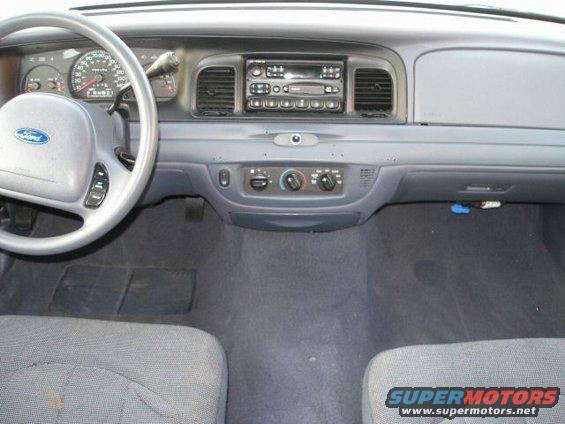 2001 Ford Crown Victoria interior dashboard with steering wheel and radio