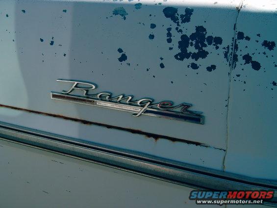 1969 Ford F-100 Ranger emblem on light blue paint