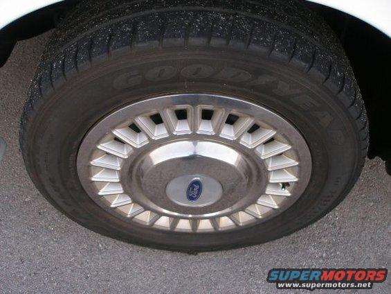 Close-up of a Ford wheel cover with a Goodyear tire