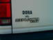 1993 Ford Explorer - Close-up of a white Ford Explorer XLT badge with custom text, showing part of the taillight.